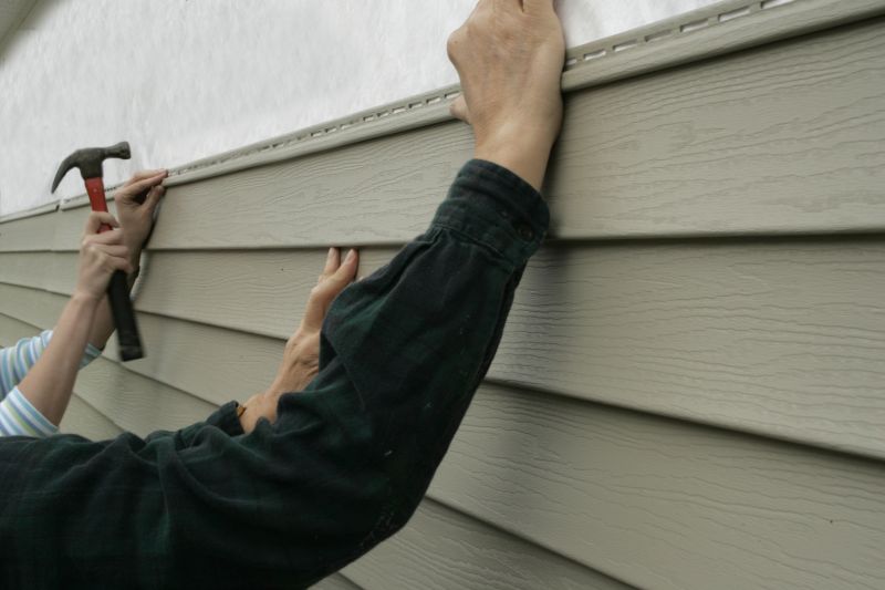 Installing vinyl siding panels
